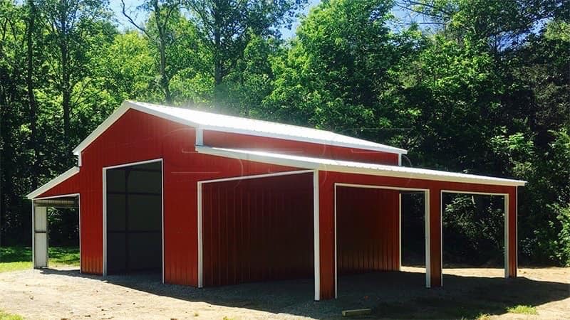 Red steel barn with an open lean-to on the side